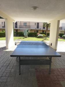 a ping pong table in front of a building at L'OREE DU GOLF in Mandelieu-la-Napoule