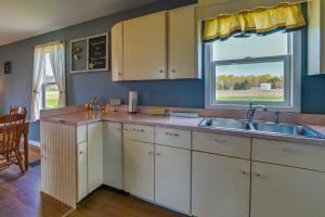 a kitchen with a sink and a window at Upstate New York Vacation Rental Near Cooperstown! in Cherry Valley