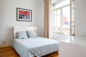 Posteľ alebo postele v izbe v ubytovaní Appart Théâtre St Étienne Wi-Fi gratuit