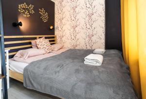 Кровать или кровати в номере Gdynia Cozzi Apartment