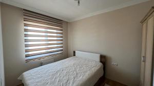 Un ou plusieurs lits dans un hébergement de l'établissement Yıldızlı small house