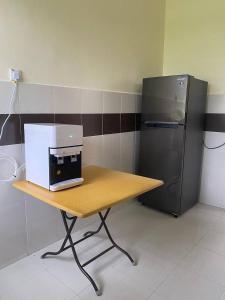 Kuchyň nebo kuchyňský kout v ubytování GEYI HOMESTAY