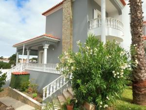 a villa with a staircase to a house at Luxury Apartment 4 Bedrooms Pool in Marisol in Corroios