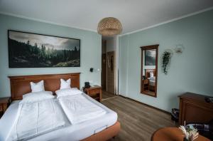 Postel nebo postele na pokoji v ubytování Alpenstadthotels