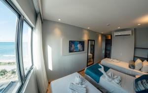 Postel nebo postele na pokoji v ubytování Hotel Água de Coco