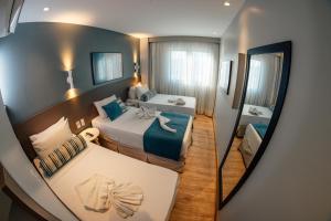 Postel nebo postele na pokoji v ubytování Hotel Água de Coco