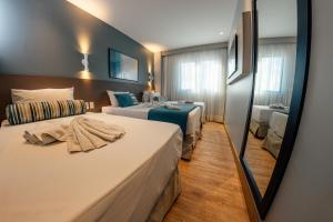 Postel nebo postele na pokoji v ubytování Hotel Água de Coco