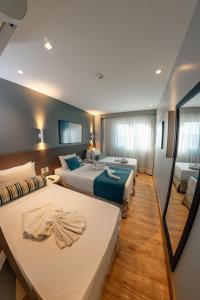 Postel nebo postele na pokoji v ubytování Hotel Água de Coco