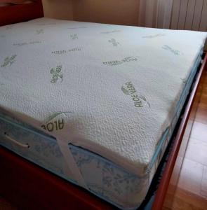 A bed or beds in a room at MUN Apartment - Major Unforgettable Nights