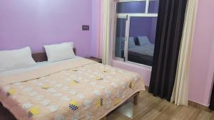 Postel nebo postele na pokoji v ubytování Hotel Aashirwad