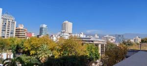 a view of a city skyline with tall buildings at Fuente Mayor Hotel Centro in Mendoza
