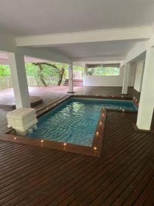 a swimming pool in the middle of a house at “Fyndraai” the home away from home in Gillitts