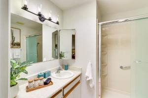 a bathroom with a sink and a shower at 5 Mi to Ocotillo Golf Course Chic Sun Lakes Home! in Sun Lakes +17 photos