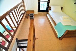 A bed or beds in a room at Zennova #23 Nikiti Family Green Nest