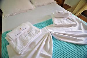 A bed or beds in a room at Zennova #23 Nikiti Family Green Nest