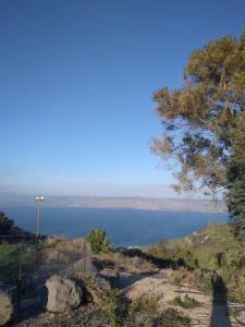 a view of a lake from the top of a hill at LTD Hadas Garden apartment in Tiberias