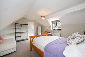 a bedroom with two beds in a attic at Stunning Detached House in Bassett in Southampton