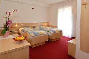 Postel nebo postele na pokoji v ubytování Hotel Zanon