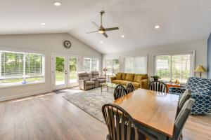 a living room with a table and chairs at Charming Bluffton Vacation Home with Smart TVs! in Bluffton