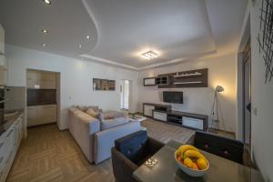 a living room with a couch and a table at Apartments Milunović in Kotor