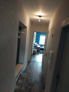 a hallway leading to a living room with at Les mésanges in Laquenexy