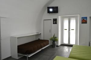 TV a/nebo společenská místnost v ubytování Le Casette della Panoramica