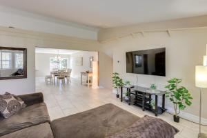 a living room with a couch and a table at 3 Mi to Casinos Reno Home with Fenced Yard! in Reno