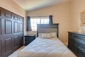 a bedroom with a bed and a window and a door at 3 Mi to Casinos Reno Home with Fenced Yard! in Reno
