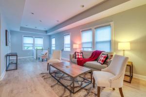 a living room with a couch and chairs and a table at Washington DC Gem with Fenced Backyard in Washington