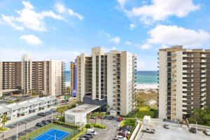 an aerial view of apartment buildings and the ocean at Phoenix VIII 1406 in Orange Beach