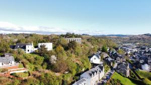an aerial view of a town with houses and trees at Kenavara House in Oban
