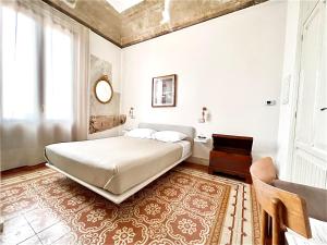Posteľ alebo postele v izbe v ubytovaní DOMUS ALERIA Deluxe Rooms