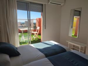 Postel nebo postele na pokoji v ubytování Hostal Garamar