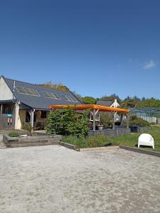 a building with a roof with solar panels on it at Le panorama in Guérande