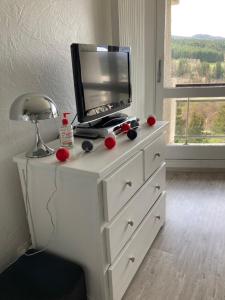 Televízia a/alebo spoločenská miestnosť v ubytovaní Au pied des pistes Côte 2000 - Le Balcon de Villard de Lans
