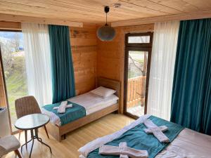 a bedroom with two beds with crosses on them at Hotel Khulo lnn in Khulo