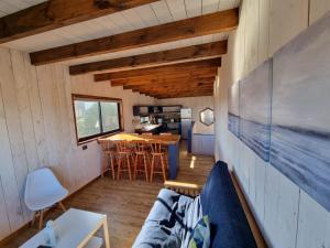 a living room with a couch and a table at Morros del Pacífico in Pichilemu