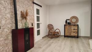 a living room with a fireplace and a wooden floor at Casa FotoStudi37 in Deltebre