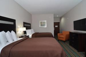 Postel nebo postele na pokoji v ubytování Quality Inn & Suites Kenedy - Karnes City