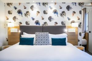 Кровать или кровати в номере Holiday Inn Perpignan by IHG