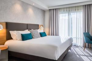 Кровать или кровати в номере Holiday Inn Perpignan by IHG