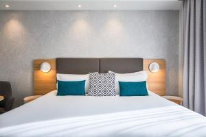 Кровать или кровати в номере Holiday Inn Perpignan by IHG