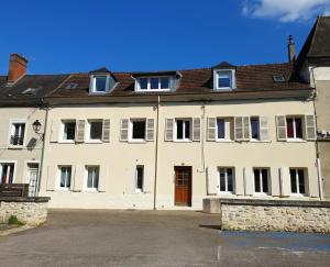 a large white building with a lot of windows at Appartement avec terrasse in Gaillon