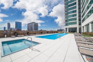 a swimming pool on the roof of a building at Penthouses near Fulton Market-Cloud9-365 in Chicago