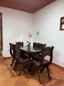 a dining room with a table and some chairs at Waka Maru in San Agustín