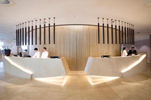 a lobby with people standing in a building at HOTEL NACIONAL - Não tem café da manhã incluído in Rio de Janeiro +21 photos