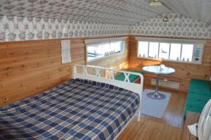 Ένα ή περισσότερα κρεβάτια σε δωμάτιο στο Vuosnaisten Meriasema