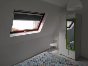 Łóżko lub łóżka w pokoju w obiekcie Vivienda en el casco histórico de Baiona