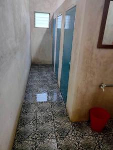 a hallway with a tiled floor in a bathroom at Anjung Afilia 1 in Kuala Kangsar