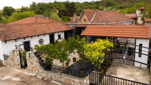 an aerial view of two white houses with red roofs at Country Side Cozy Villa in Kalabaka